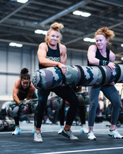 "Turf Games teams using the 2-Person Worm to simulate real-world challenges and excel in team-focused movements."